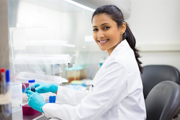Scientist working in laboratory with test tubes