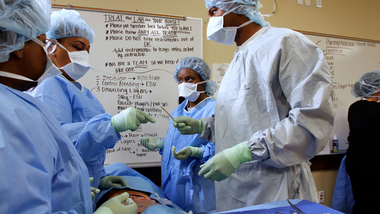 Medical team in surgical training session with instructions
